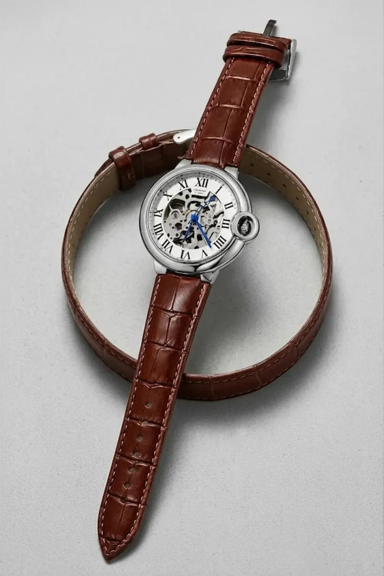 Elegant analog wrist watch featuring Roman numerals and blue hands.

