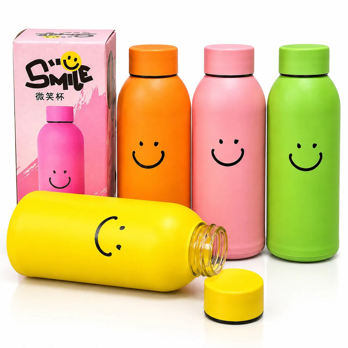 Colorful glass insulated smiley face water bottles on a marble kitchen counter