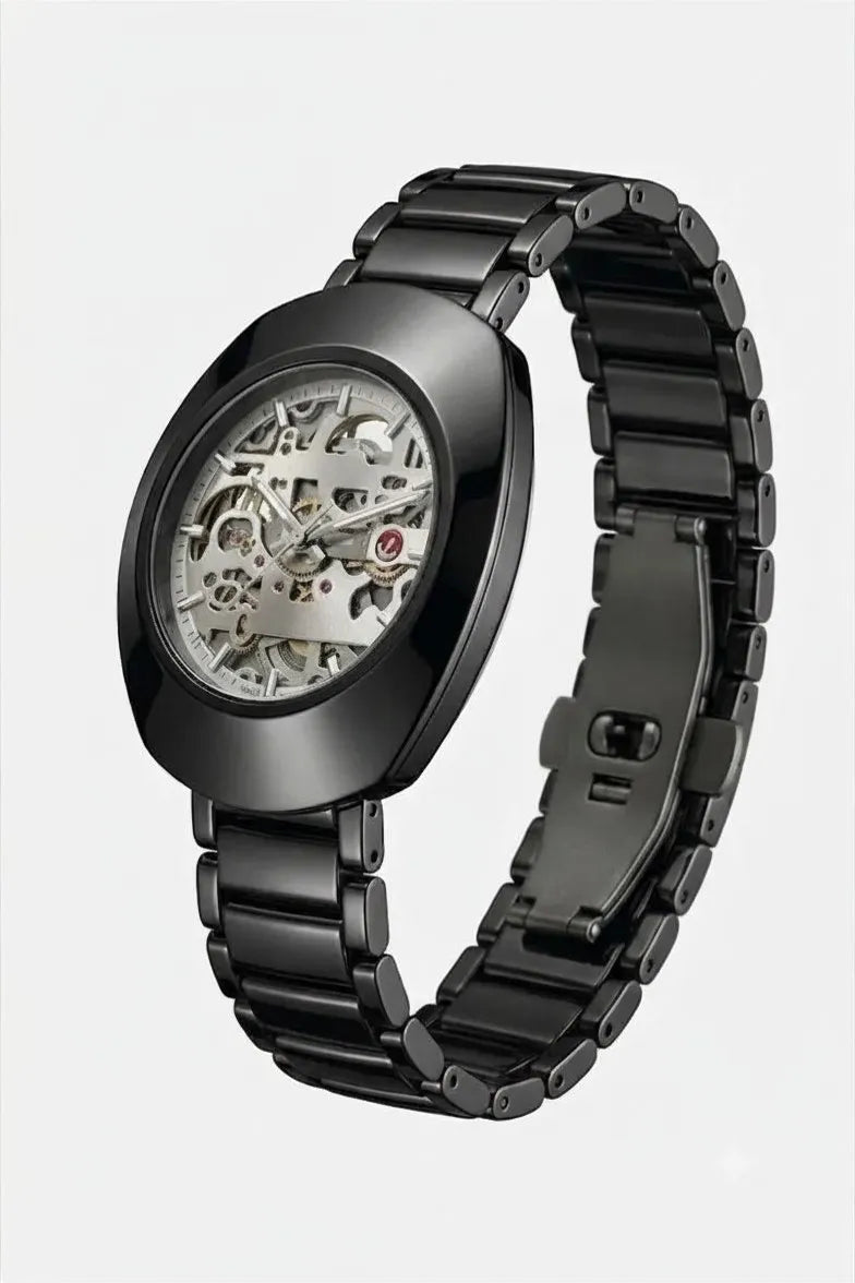 Luxury black analog wrist watch featuring an open-work skeleton dial.