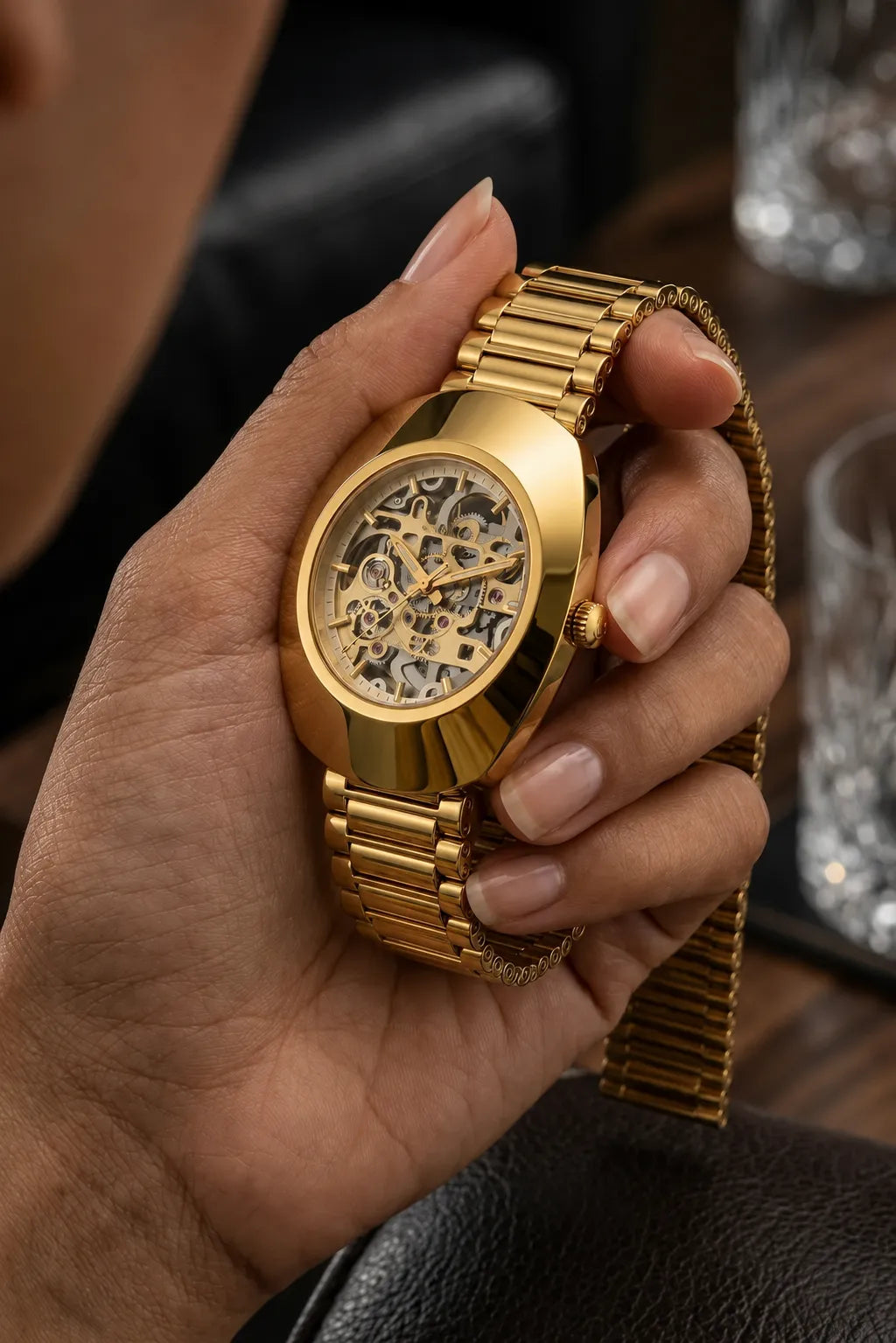 Luxury gold skeleton dial men's watch with stainless steel bracelet.

