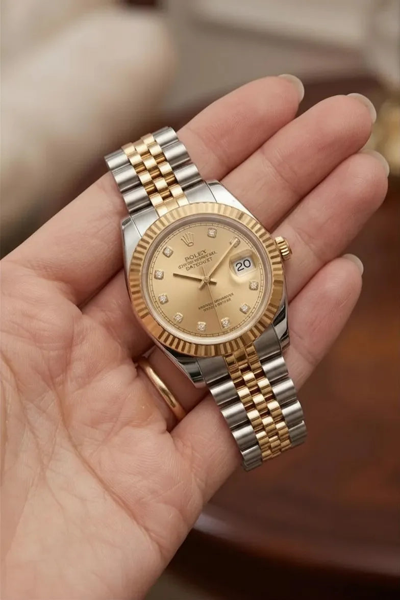 Luxury two-tone stainless steel men's watch with champagne dial and date display.
