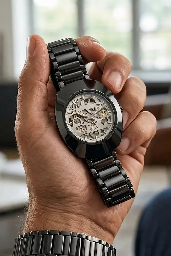 Premium black skeleton dial men's watch with stainless steel bracelet.
