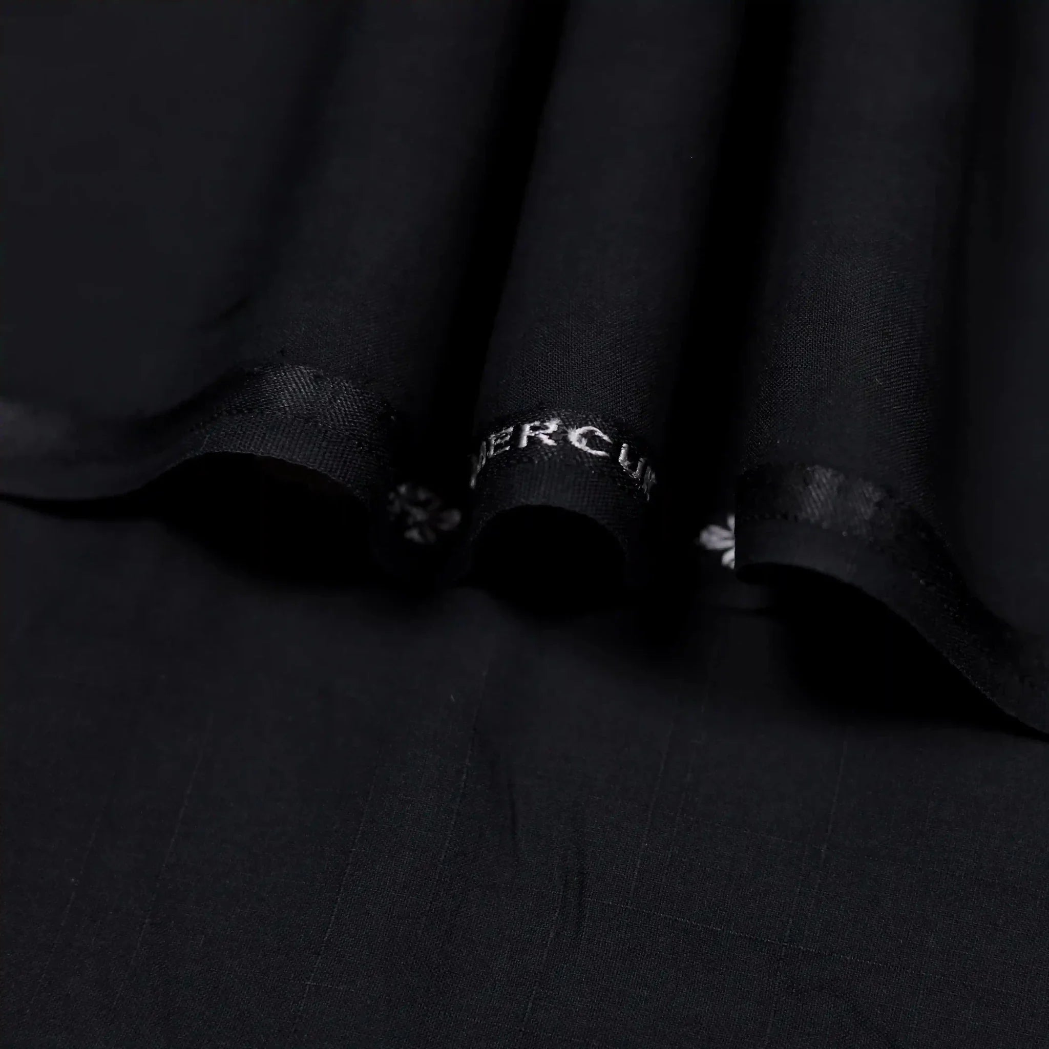 Elegant black self textured wash and wear unstitched suit.
