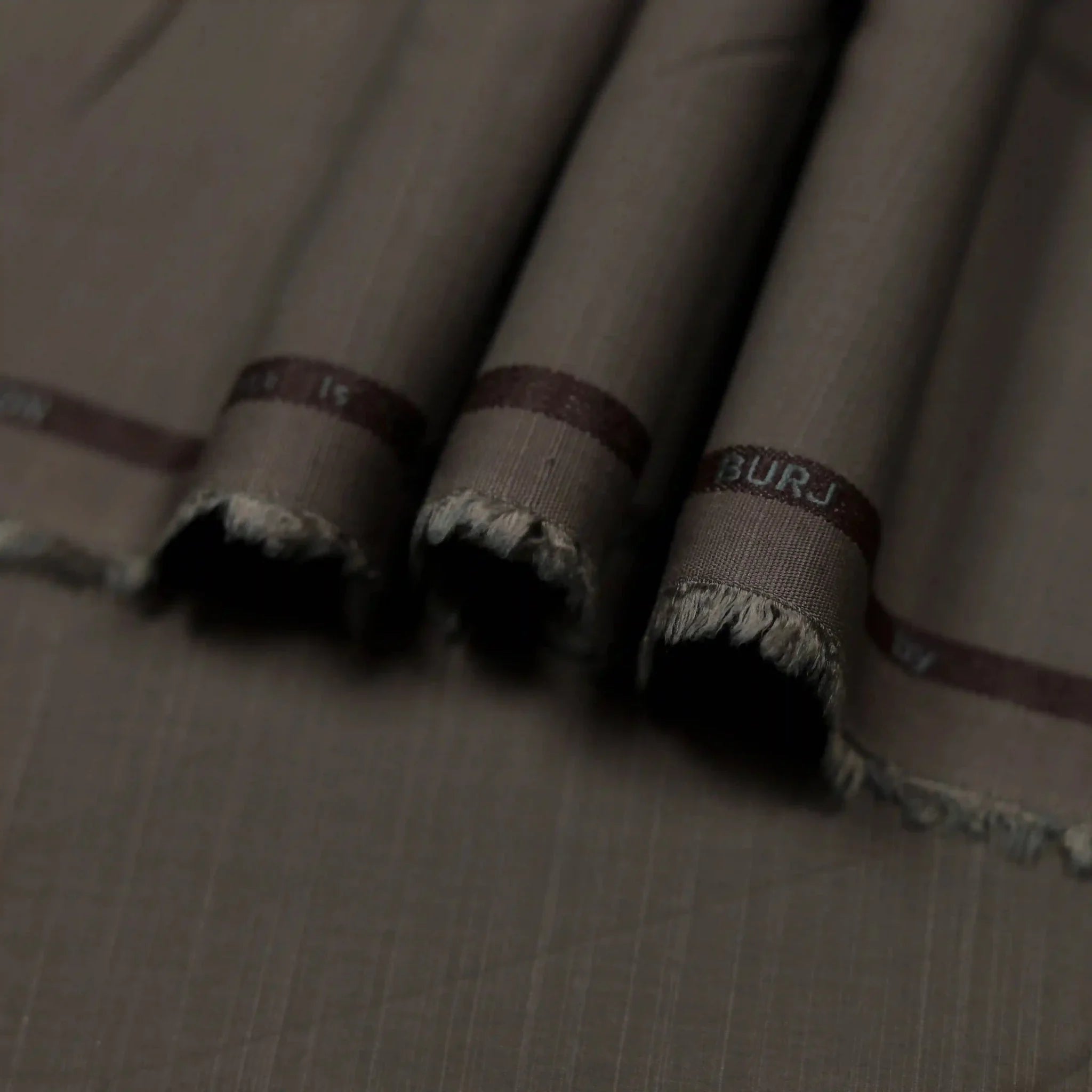 Elegant brown self-textured Wash & Wear suit for men.
