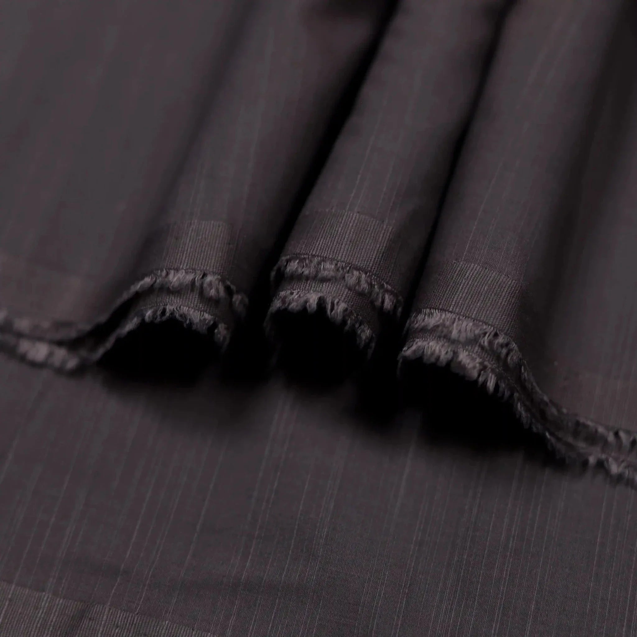 Elegant Purple Brown self textured wash and wear suit for men.
